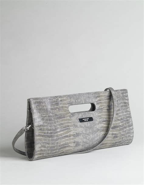 does michael kors use fake snake skin clutch|michael kors counterfeit bags.